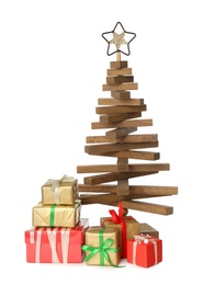 Decorative wooden Christmas tree with gift boxes on white background