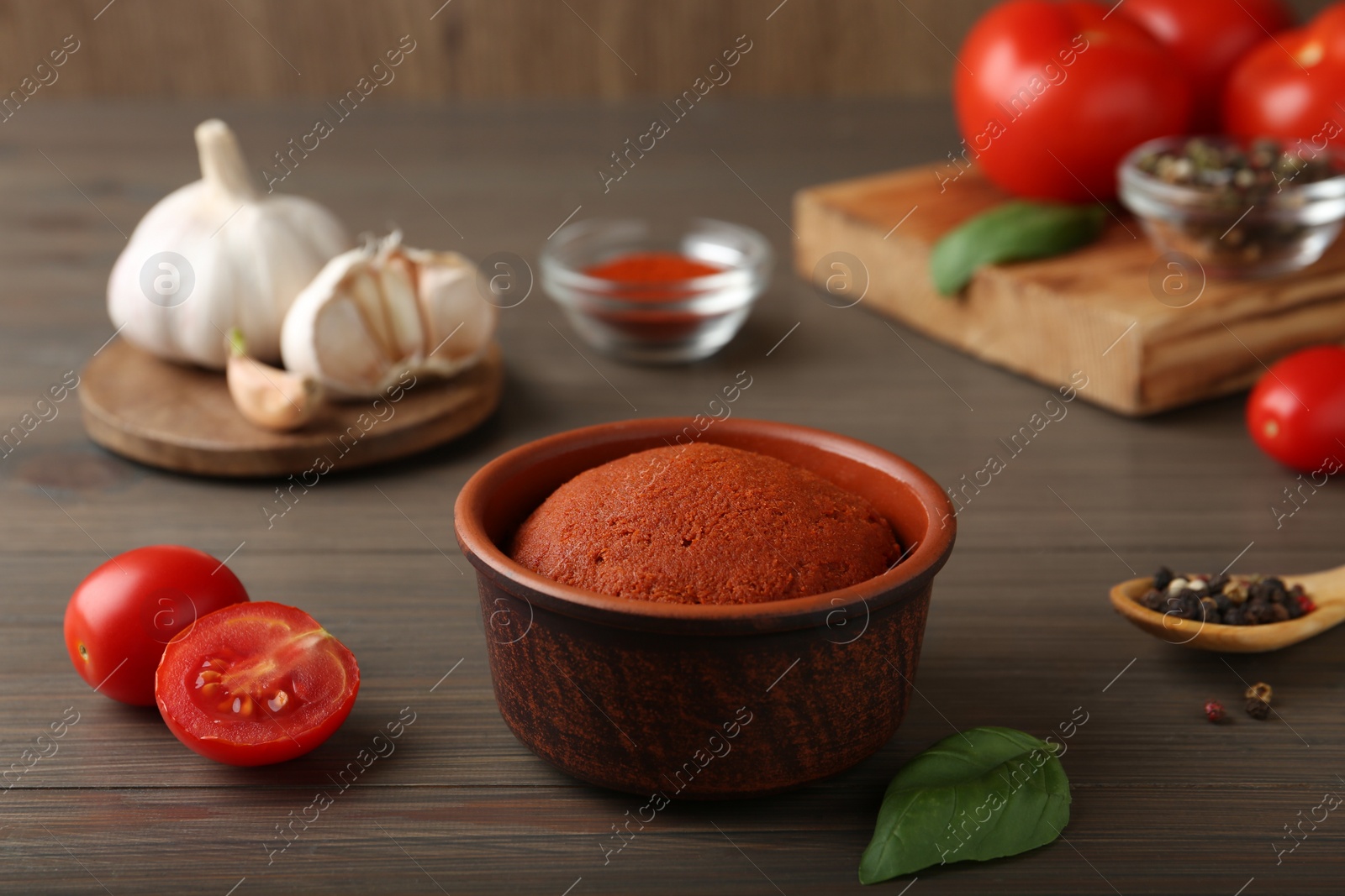 Photo of Red curry paste and ingredients on wooden table