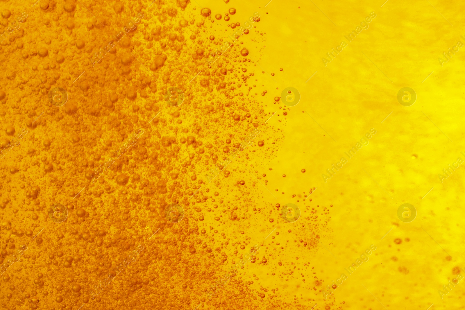 Photo of Tasty beer with bubbles as background, closeup