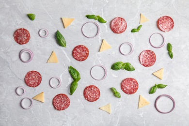 Photo of Flat lay composition with ingredients for pizza on light table