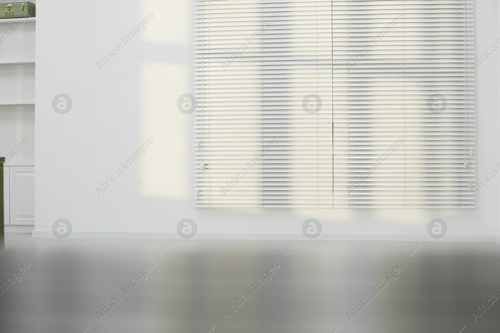 Photo of Light and shadows from window on wall indoors