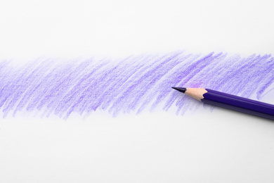 Photo of Purple pencil on sheet of paper with drawing, top view