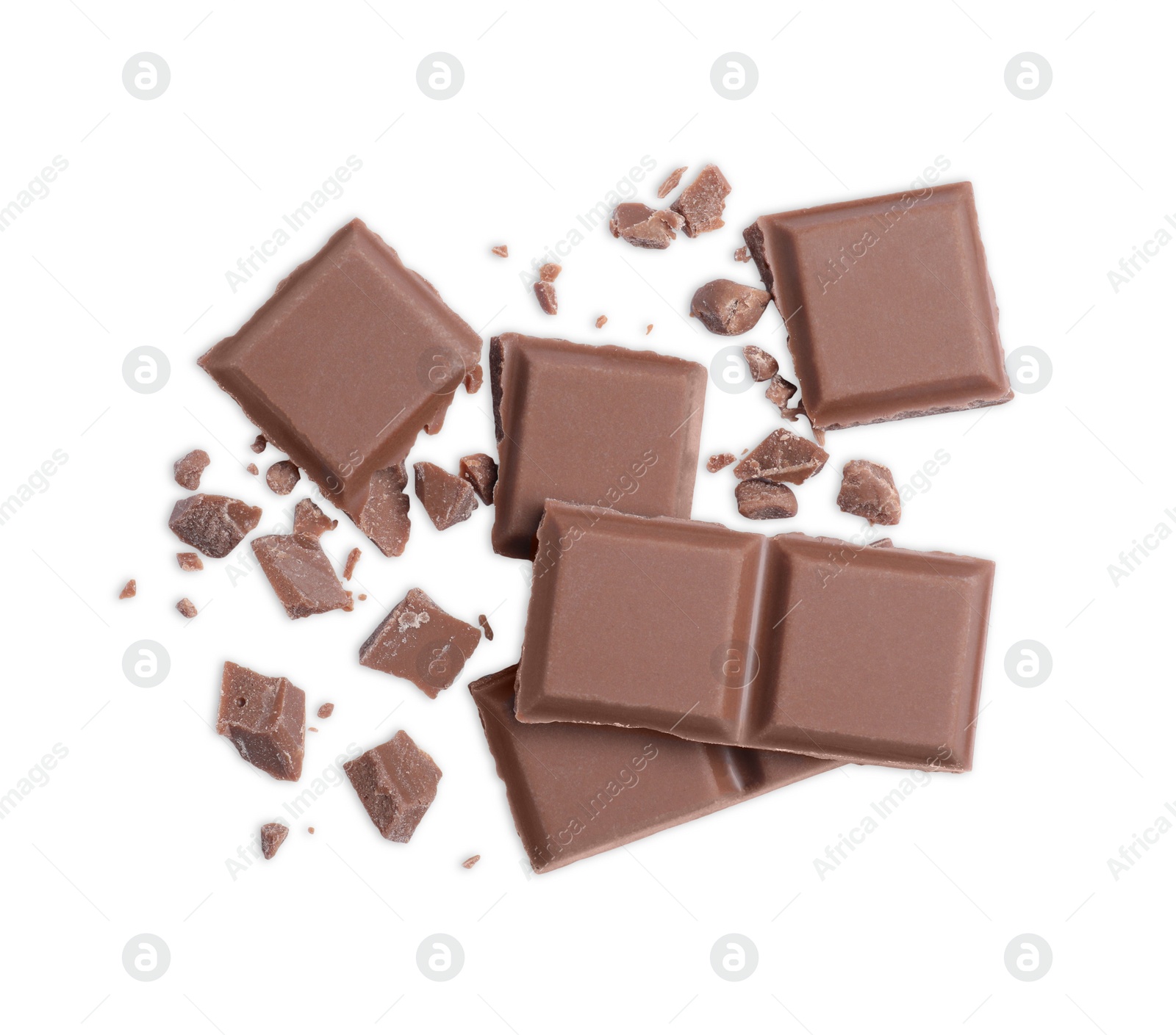 Photo of Pieces of delicious milk chocolate bar on white background, top view