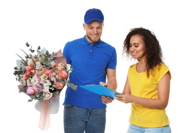 Photo of African-American woman receiving flower bouquet from delivery man isolated on white