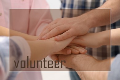 Group of volunteers putting hands together, closeup