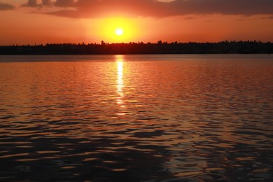 Photo of Picturesque view of beautiful sunset on riverside