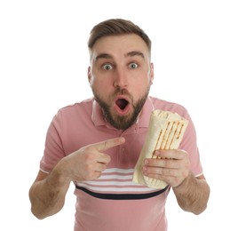 Emotional young man with delicious shawarma on white background
