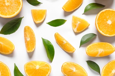 Composition with ripe oranges on white background, top view