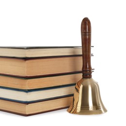 Photo of School bell with wooden handle and stack of books on white background