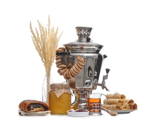 Photo of Traditional Russian samovar and treats on white background