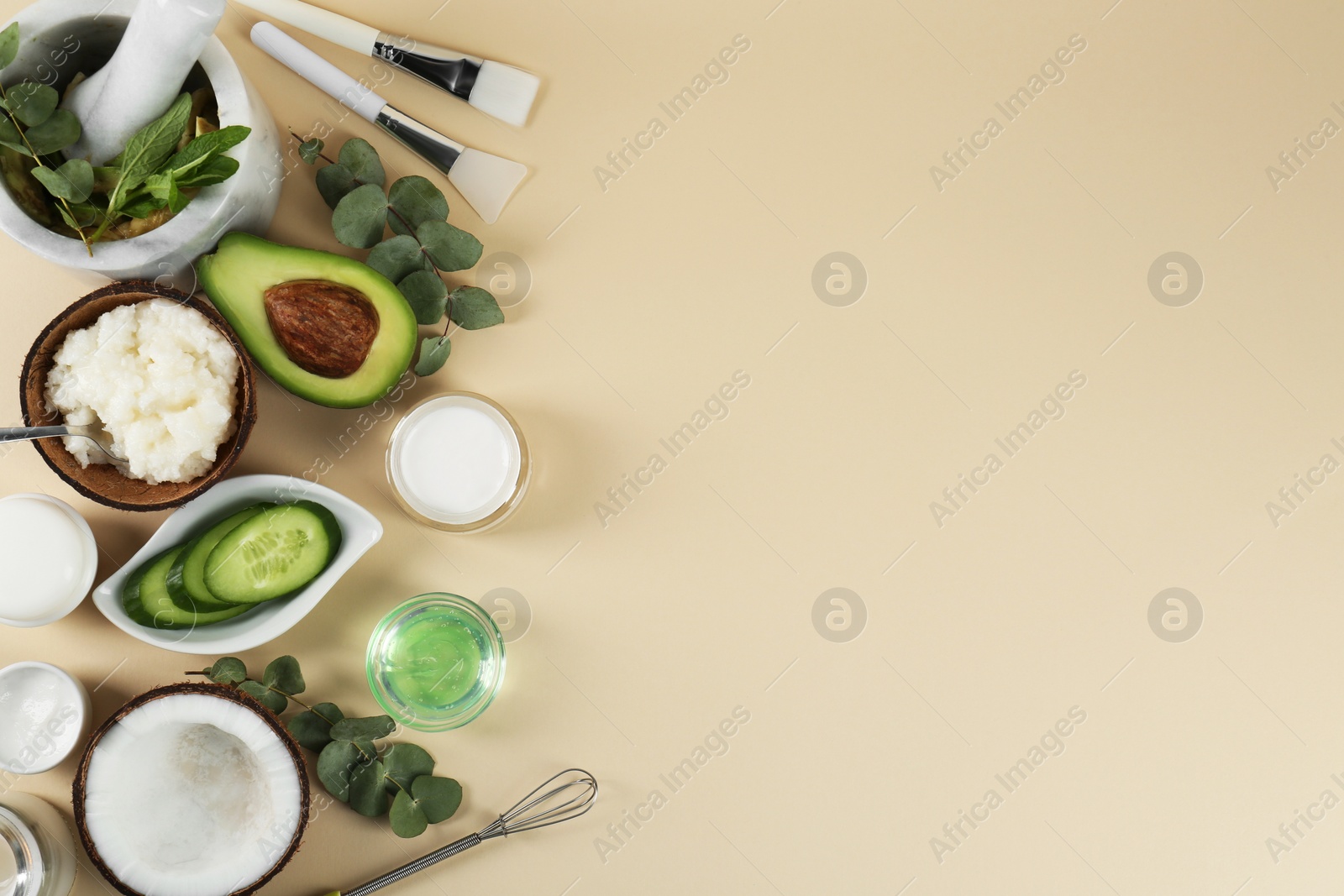 Photo of Flat lay composition with homemade cosmetic products and fresh ingredients on beige background, space for text. DIY beauty recipe