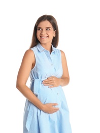 Happy pregnant woman touching her belly on white background