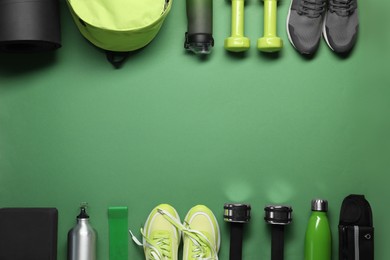 Photo of Frame made of different sports equipment on green background, flat lay. Space for text