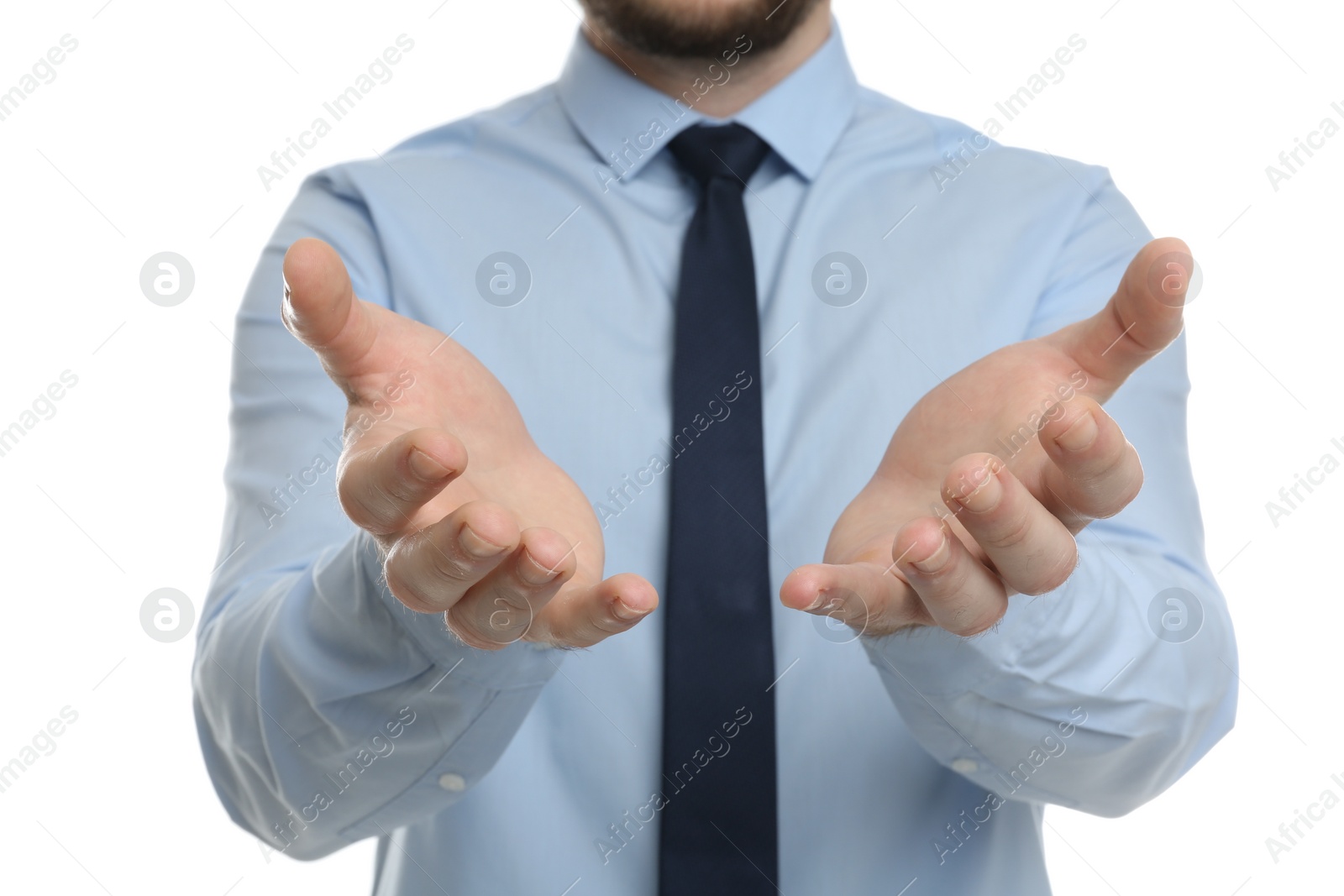 Photo of Businessman holding something against white background, focus on hands