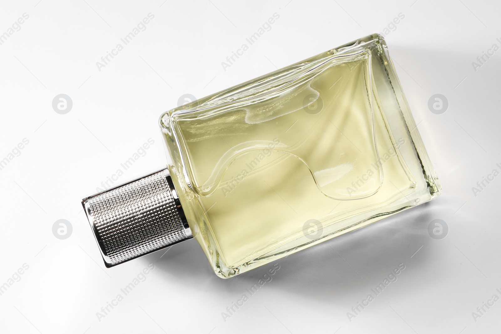 Photo of Luxury men`s perfume in bottle on white background, top view