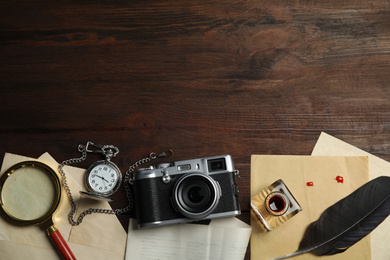 Composition with different vintage items on wooden background, space for text. Detective layout
