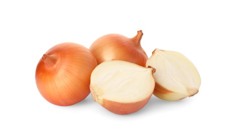 Photo of Whole and cut onions on white background