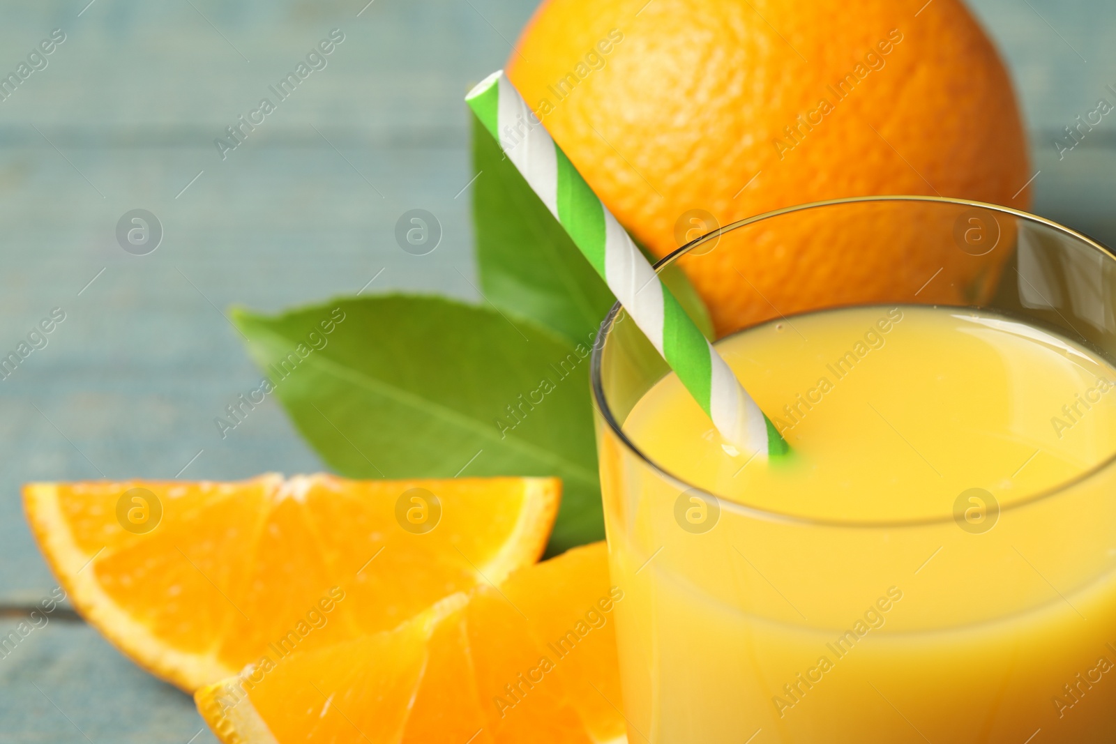 Photo of Glass of orange juice and fresh fruits, closeup