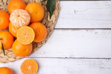 Fresh juicy tangerines on white wooden table, flat lay. Space for text