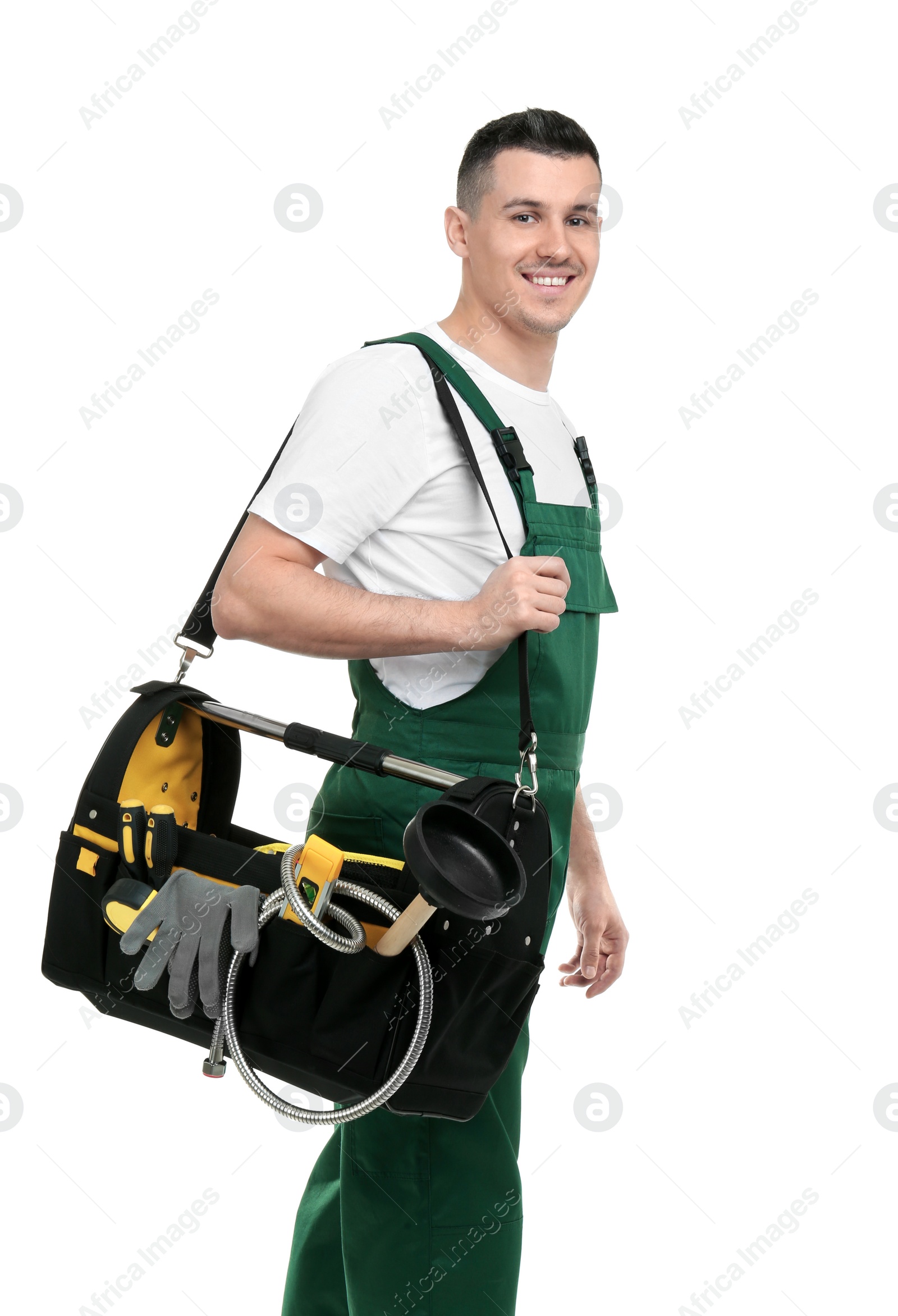 Photo of Young plumber with tool bag on white background