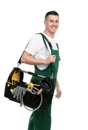 Photo of Young plumber with tool bag on white background