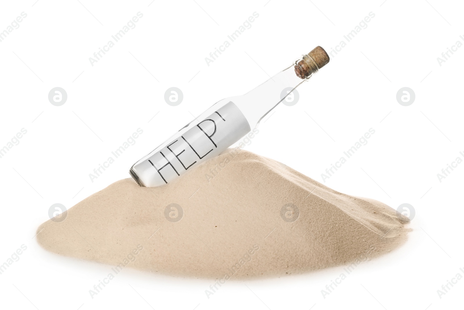 Photo of Corked glass bottle with Help note in sand on white background