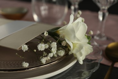 Stylish table setting with floral decor, closeup