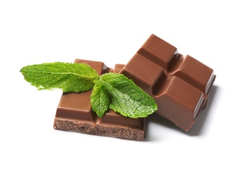 Pieces of milk chocolate with mint on white background