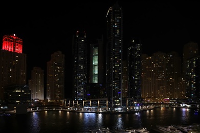 Photo of DUBAI, UNITED ARAB EMIRATES - NOVEMBER 03, 2018: Night cityscape of marina district with illuminated buildings