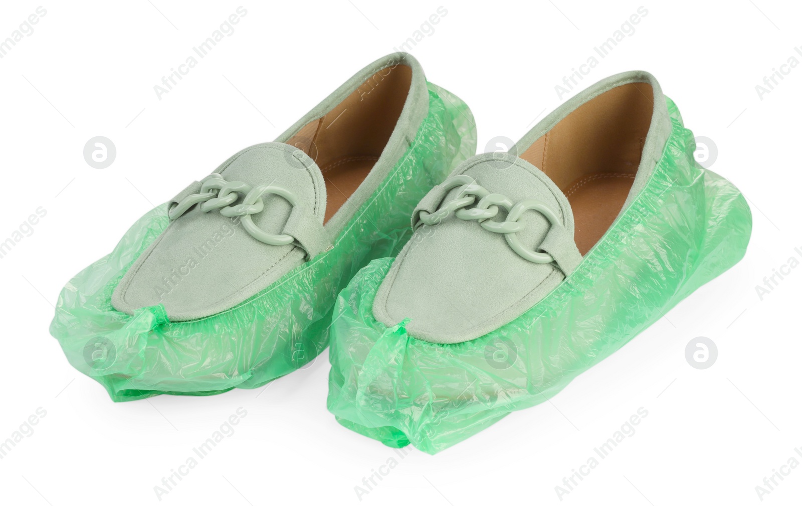 Photo of Women's mules in green shoe covers isolated on white