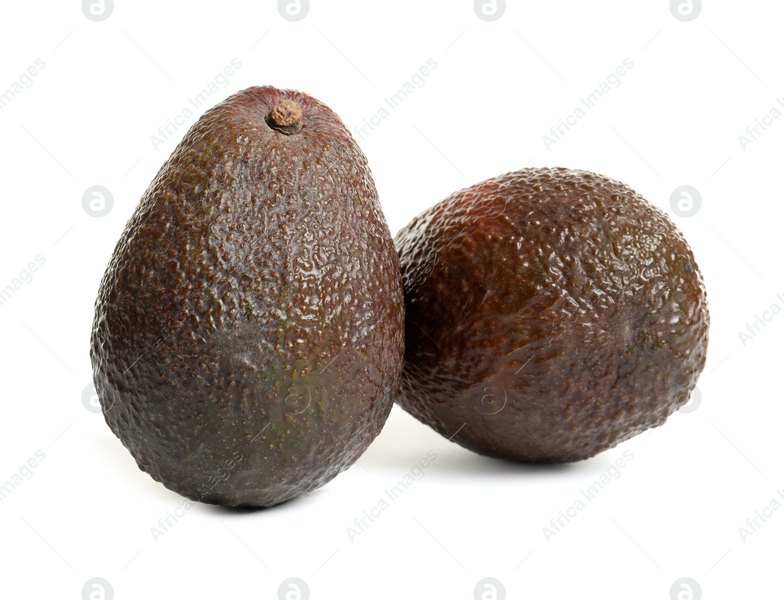 Photo of Ripe fresh avocados on white background