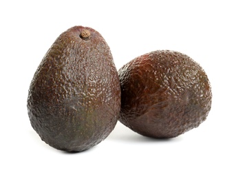 Ripe fresh avocados on white background