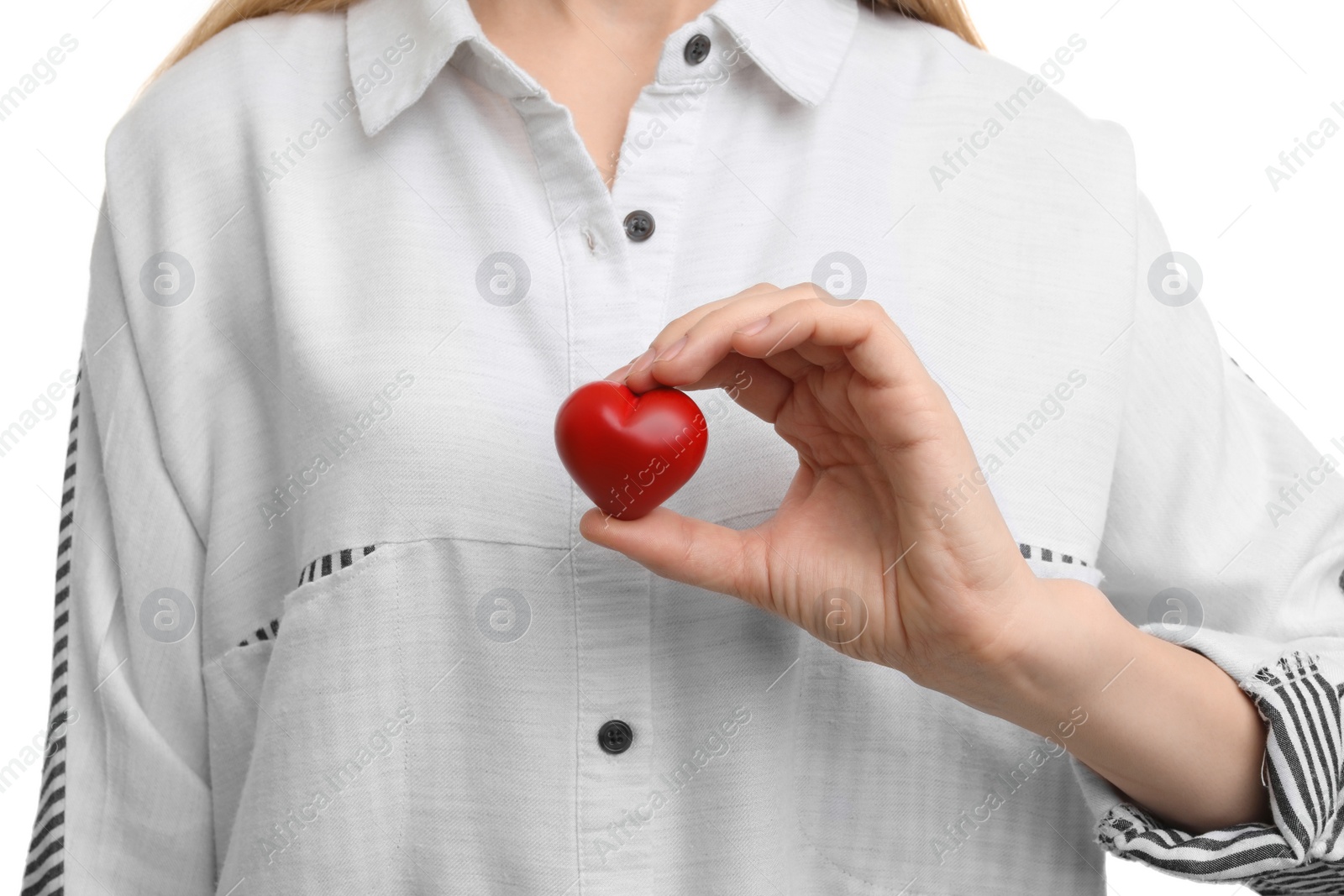 Photo of Woman holding small red heart on white background. Heart attack concept