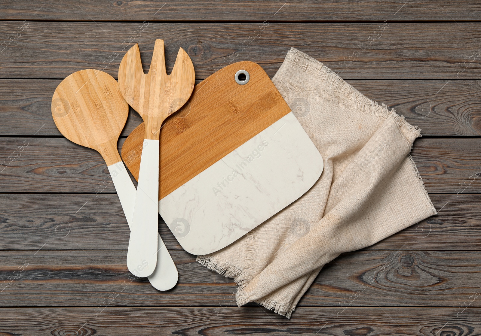 Photo of Set of modern cooking utensils on wooden table, flat lay