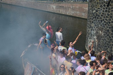 AMSTERDAM, NETHERLANDS - AUGUST 06, 2022: Many people in boat at LGBT pride parade on river