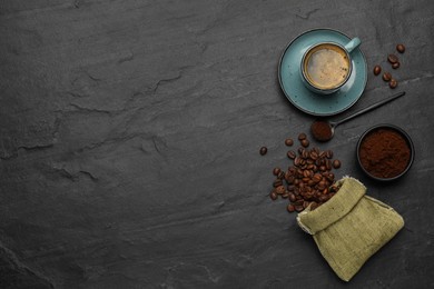 Flat lay composition with coffee grounds and roasted beans on black background, space for text