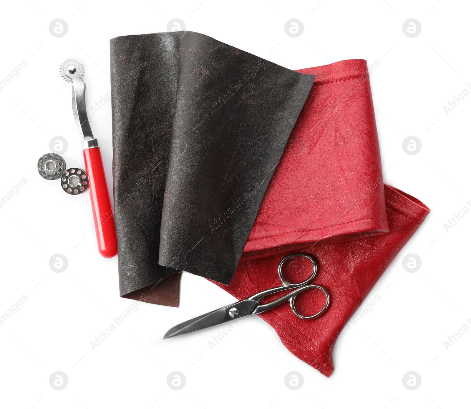 Photo of Leather samples and craftsman tools isolated on white, top view