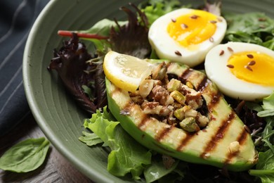 Photo of Healthy dish high in vegetable fats on table, closeup