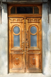 Photo of Closed vintage wooden door in old building