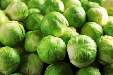 Photo of Pile of fresh Brussels sprouts as background
