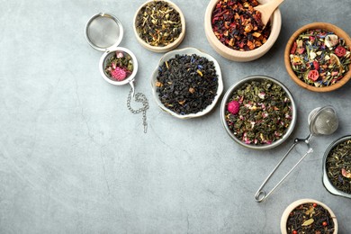 Photo of Many different herbal teas on grey table, flat lay. Space for text
