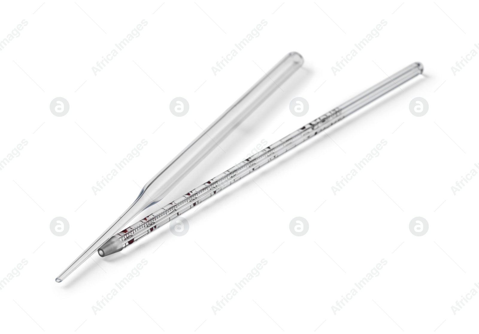 Photo of Two clean pipettes isolated on white, above view