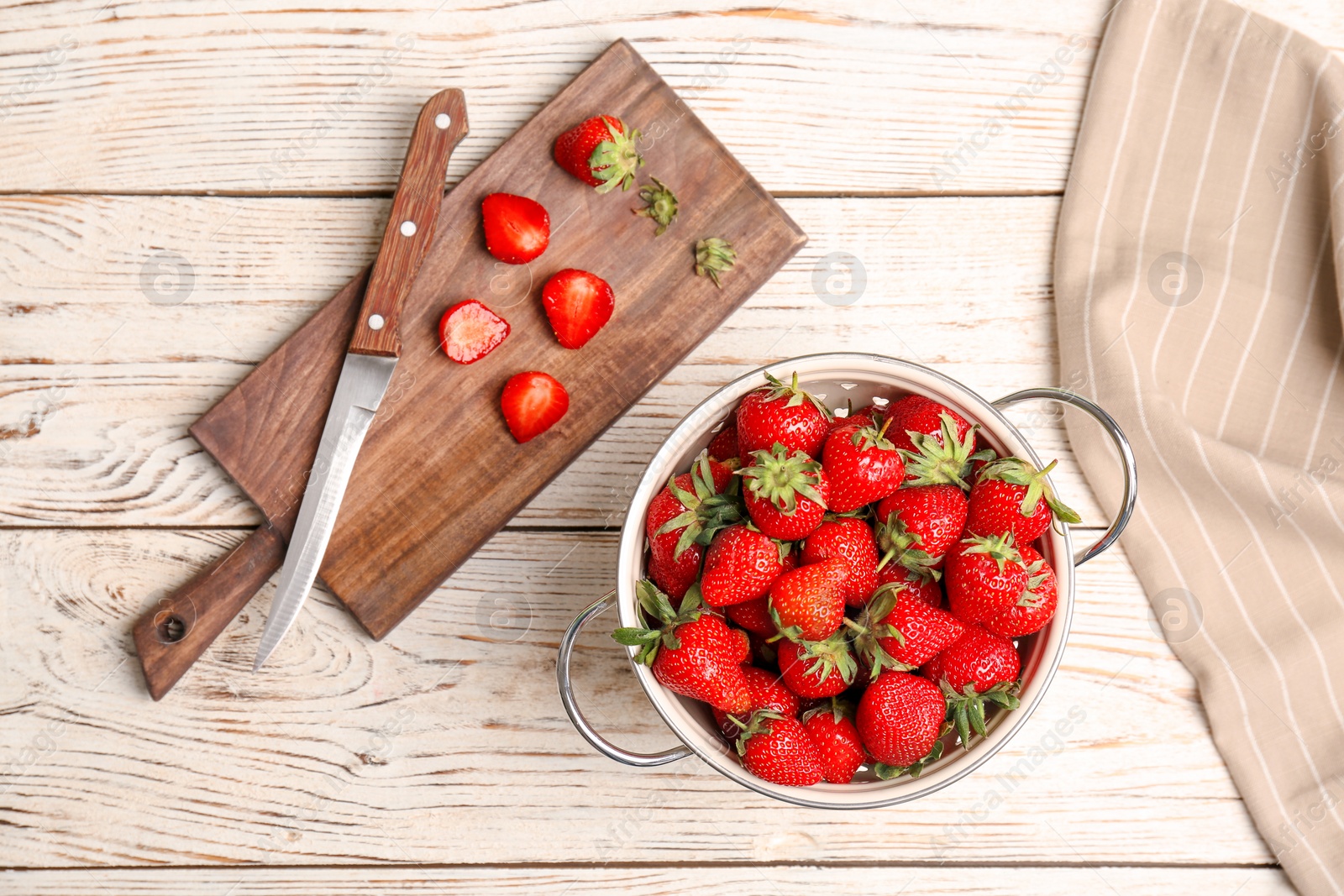 Photo of Flat lay composition with ripe red strawberries on wooden background