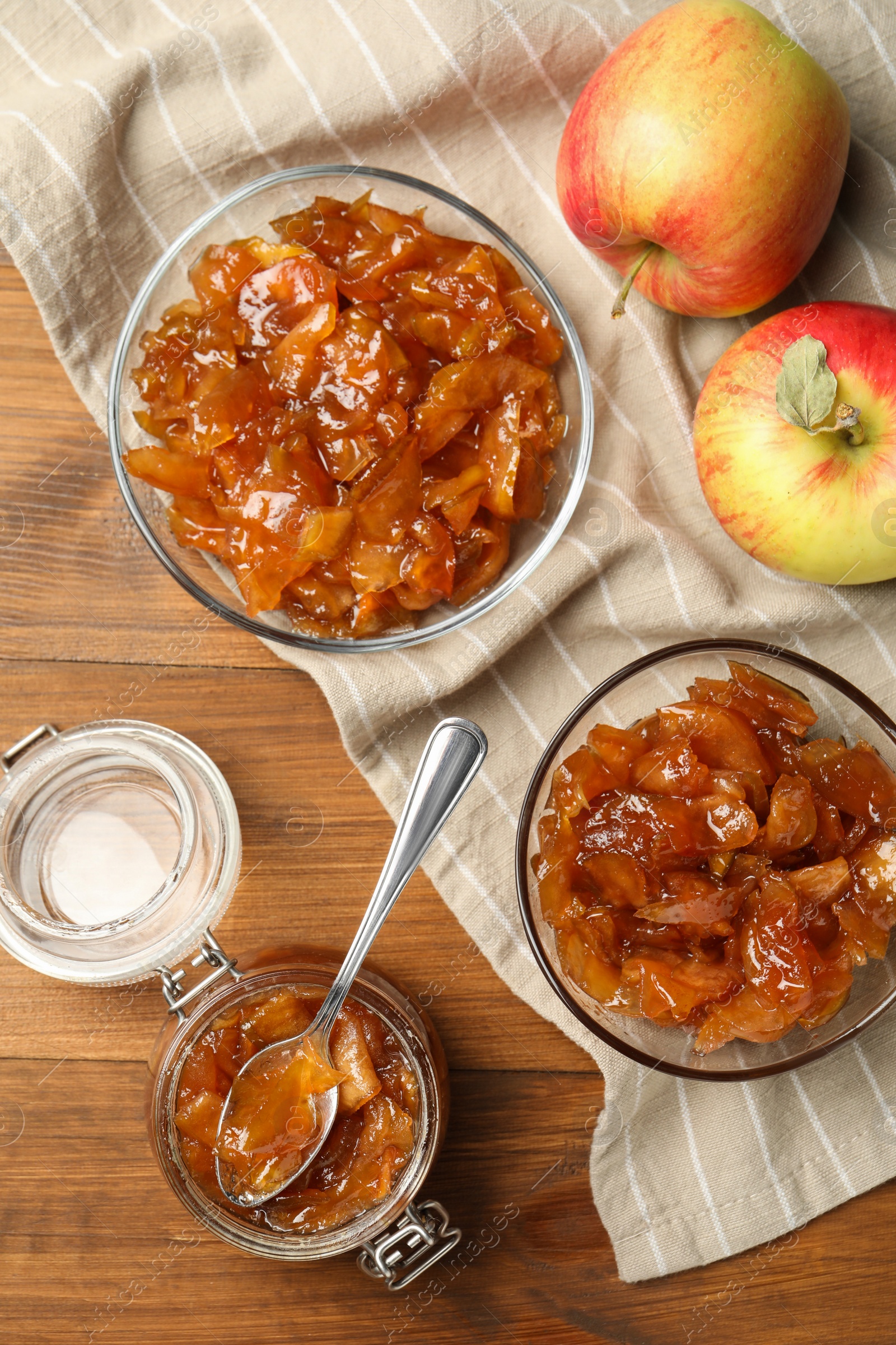 Photo of Tasty apple jam and fresh fruits on wooden table, flat lay