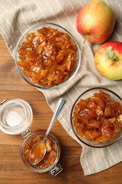 Tasty apple jam and fresh fruits on wooden table, flat lay