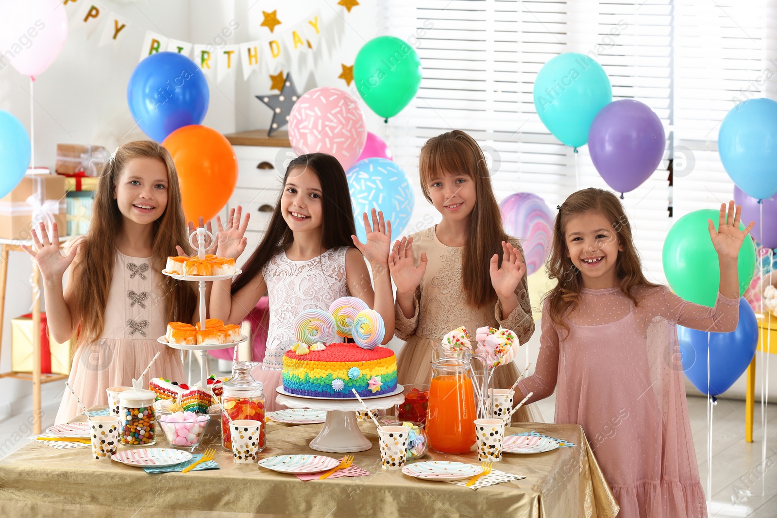 Photo of Happy children at birthday party in decorated room