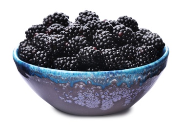 Photo of Blue bowl of tasty ripe blackberries on white background