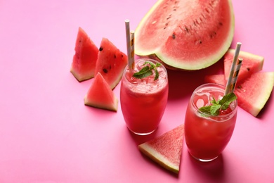Photo of Tasty watermelon drink with mint on pink background. Space for text