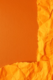 Photo of Orange textured materials as background, closeup view