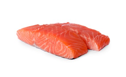 Pieces of fresh raw salmon on white background